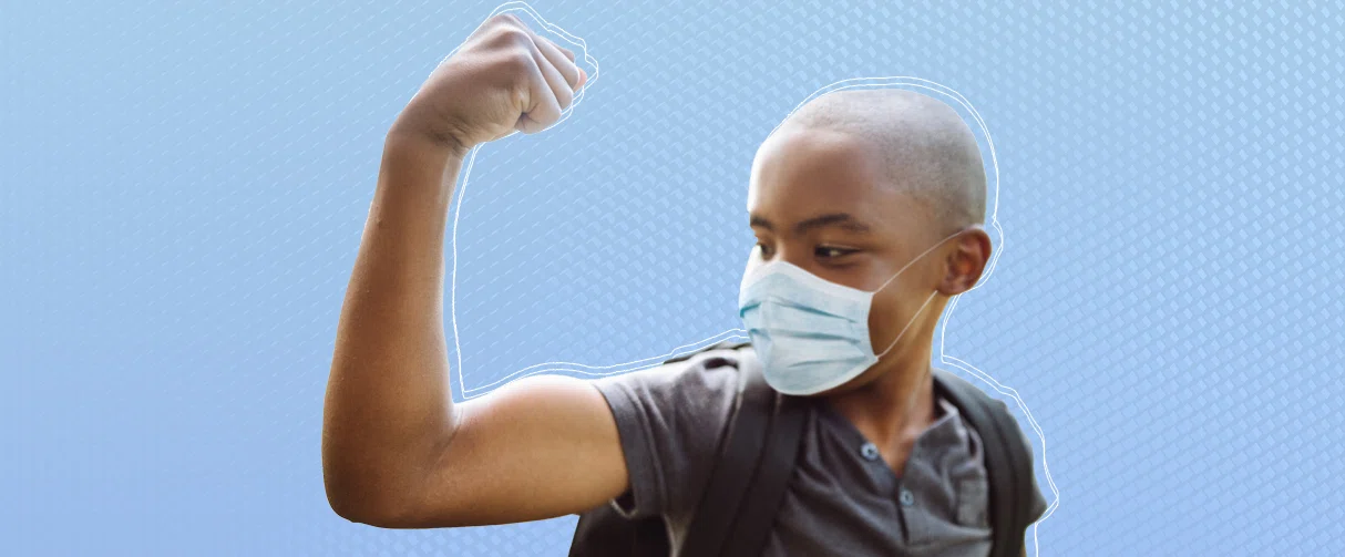 Stock photo of a child wearing a mask and flexing 